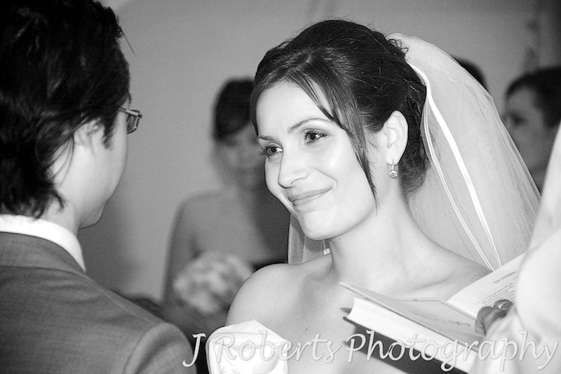 Bride smiling at groom during wedding ceremony - wedding photography sydney